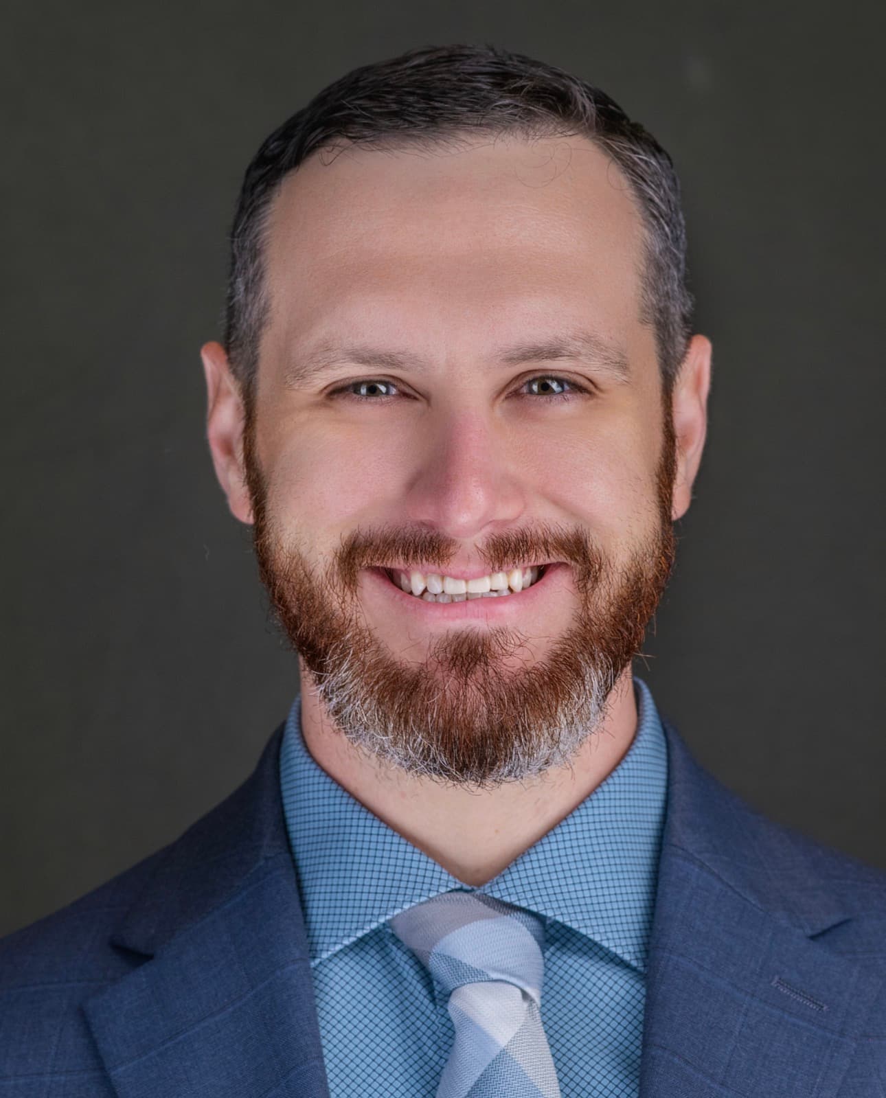 Headshot of founder, Mullen